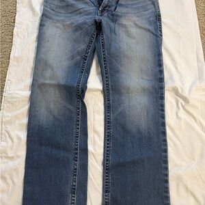 Ariat low rise boot cut jeans with frayed bottoms